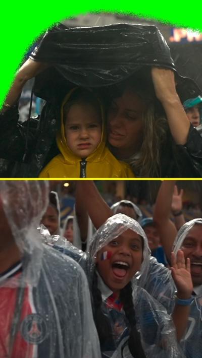 Fans sheltering form the rain 
