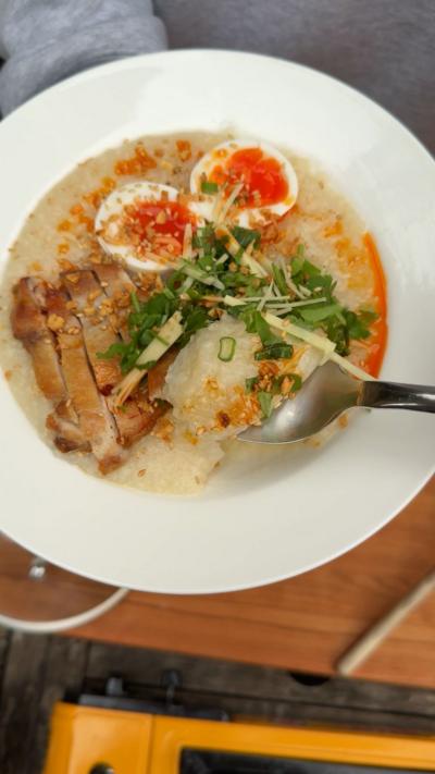 A white bowl containing chicken and eggs