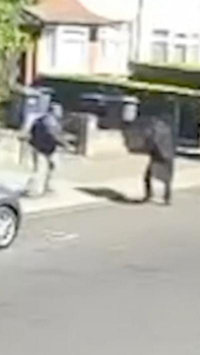 Shloime Rand and the attacker running in the street