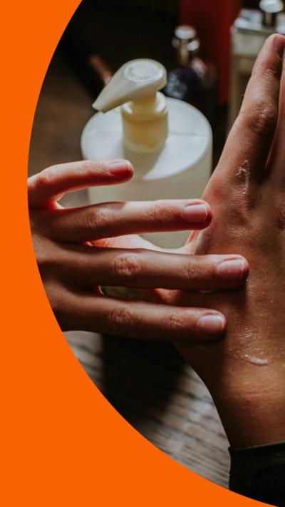 Hands applying moisturiser