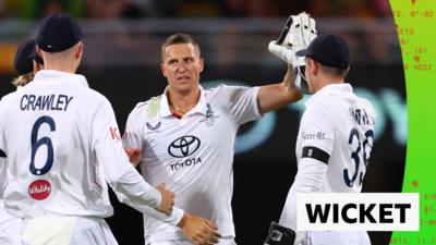 Brydon Carse celebrates with his England teammates