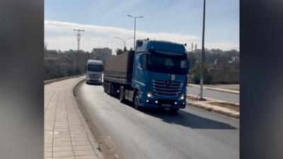 A dark blue truck on a street in Jordan