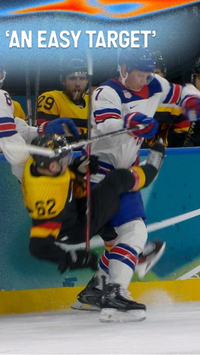 USA's Brady Tkachuk knocks down Germany's Parker Tuomie in ice hockey match