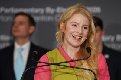 Hannah Spencer at lectern smiling