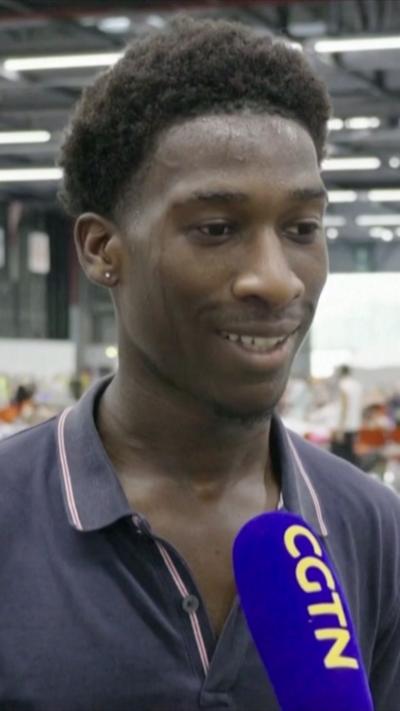 A young man talking to a news reporter 