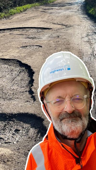 Composite image showing potholes and a man in an orange jacket, white hard hat. He has glasses and a beard