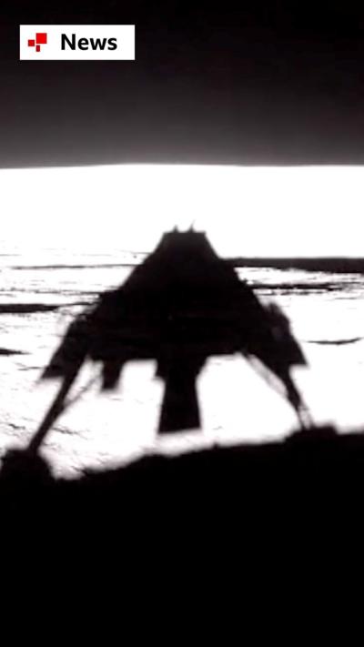 Silhouette shadow of spacecraft as it touches down on the Moon