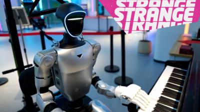 A robot playing piano and the Strange News logo