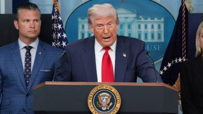 Trump is talking to the press.