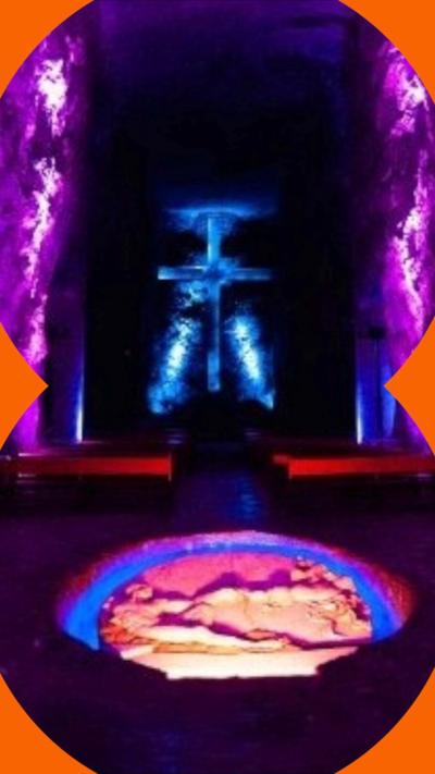 A cathedral lit in colourful lights built in a salt mine
