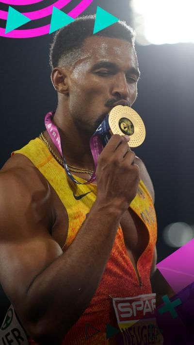 Leo Neugebauer kisses his gold medal after winning the men's decathlon
