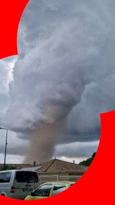 A tornado is seen in the distance