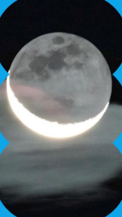 A cresent Moon, with the darker whole visible