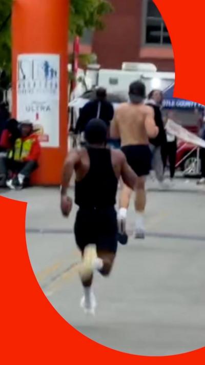 Runner running behind race's leader