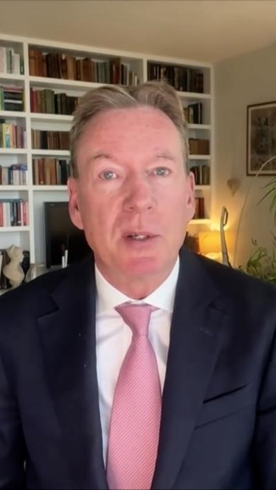 Frank Gardner wearing a shirt and a tie