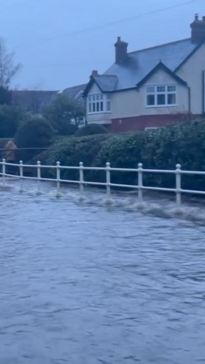 Flooding by a house.