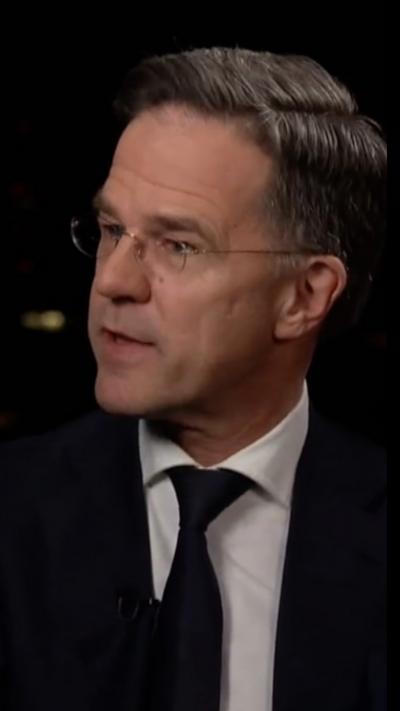 Mark Rutte in a black blazer, white shirt and tie