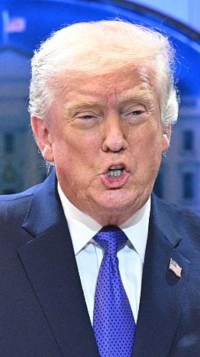 Donald Trump is talking to the press.
