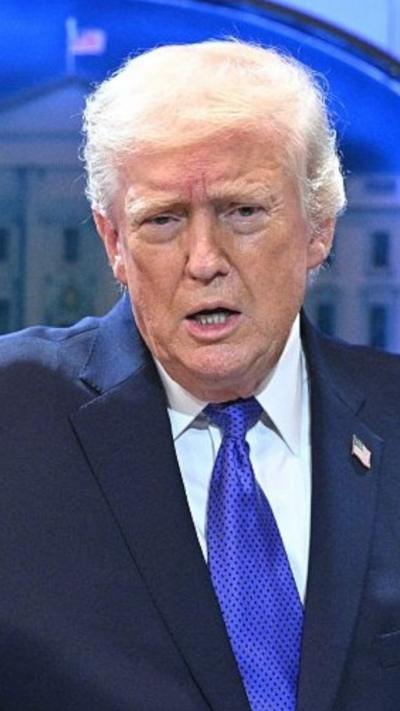 Donald Trump is talking to the press.
