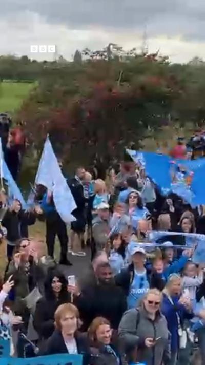 Fans in sky blue applauding the Coventry players