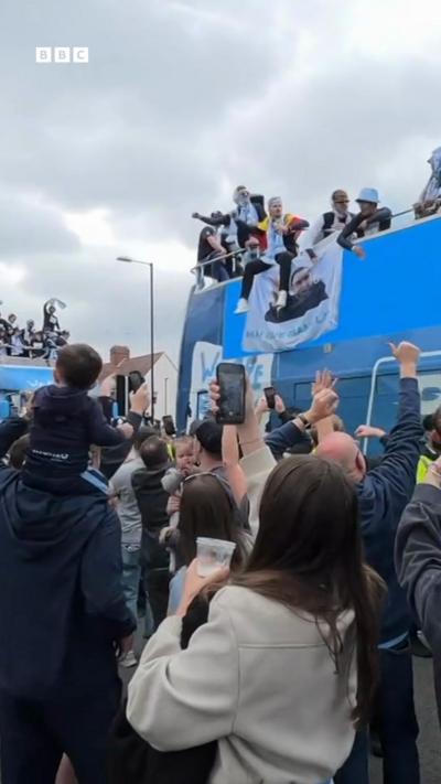 Coventry players on top of a bus