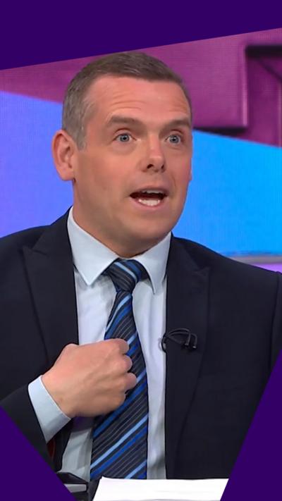 Douglas Ross - a man with short brown hair wearing a suit