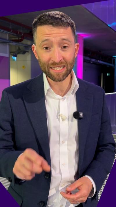 Man looking at camera in TV studio