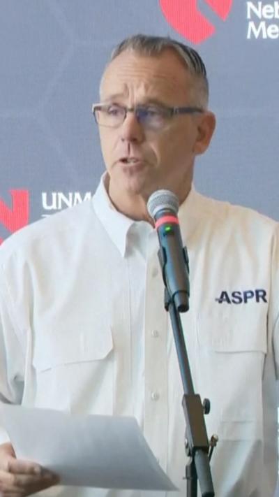 John Knox is seen talking to reporters.