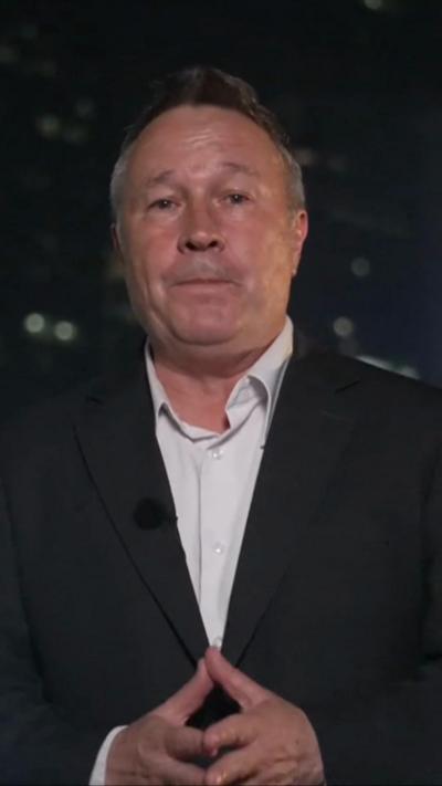 Stephen McDonnell wearing dark suit jacket and a white shirt