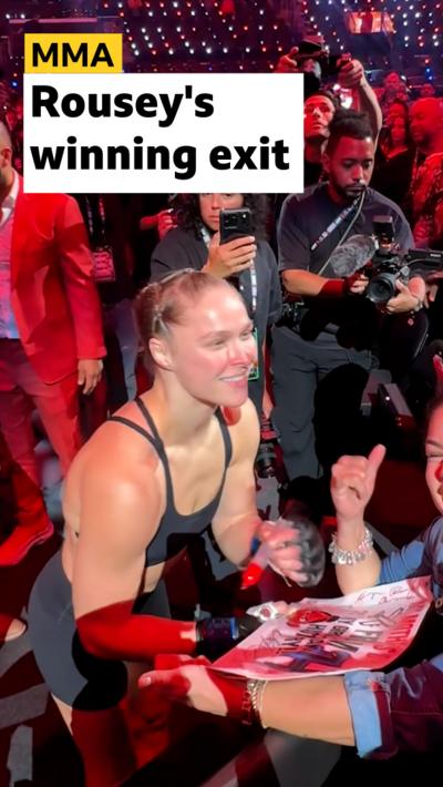 Ronda Rousey leaving cage and speaking to fan