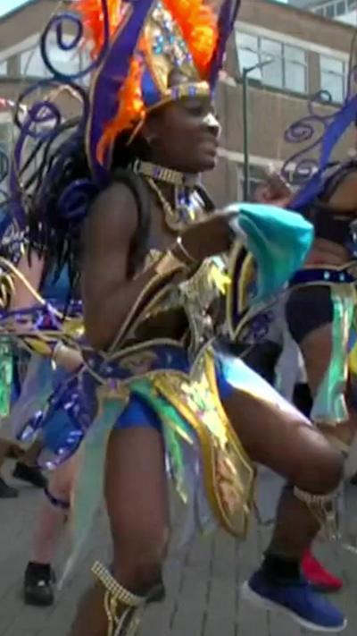 Woman dances in Luton Carnival parade