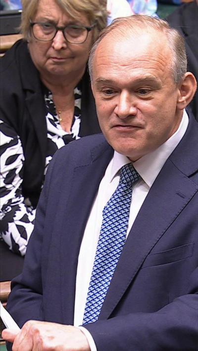 Ed Davey wearing a suit and speaking in the Commons