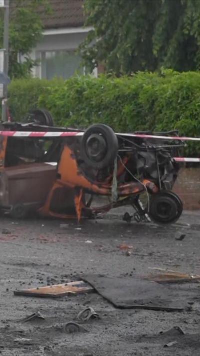 Car upside down in road