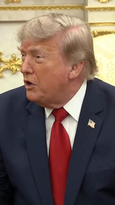 President Trump wears a red tie.