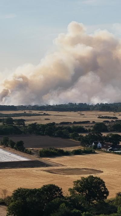 Plumes of smoke in air.