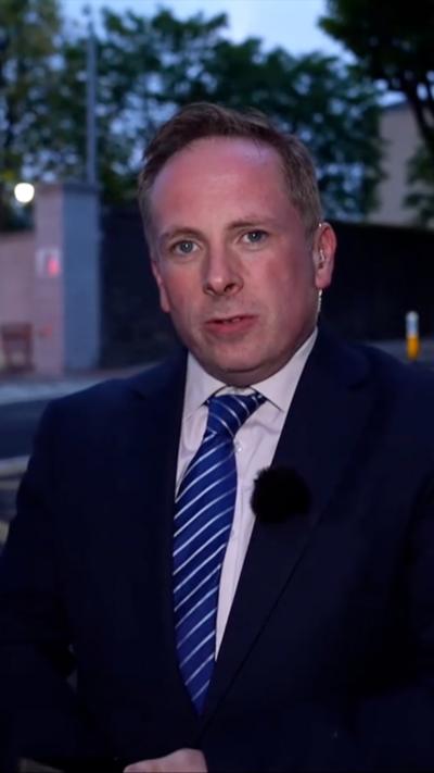 Man in a suit.