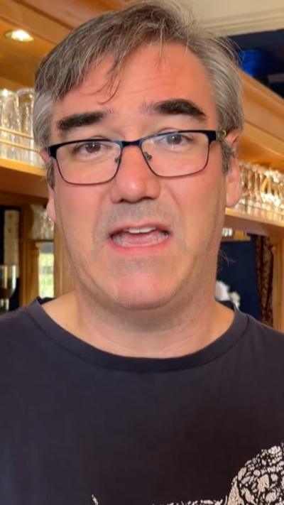 A man speaking to the camera