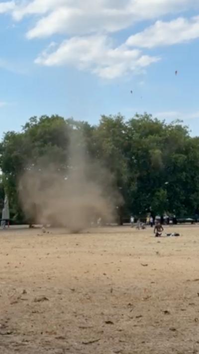 A mini tornado spinning through park