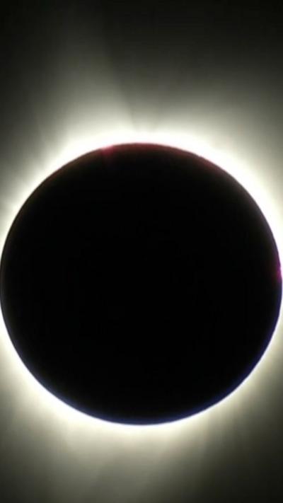 The sun covered by the moon with a ring of light around it
