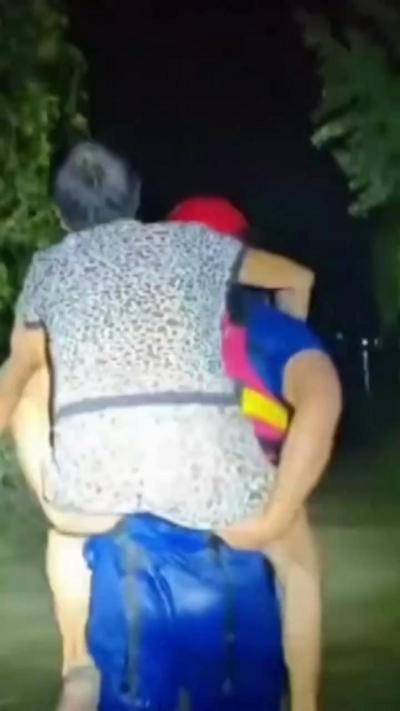 A person is carried on a firefighter's back
