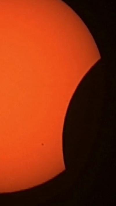 The moon covers up part of the sun during an eclipse in Norway.
