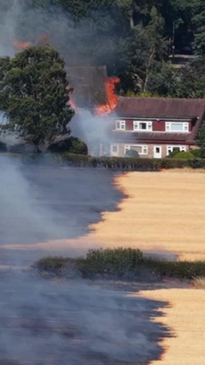 home and field on fire