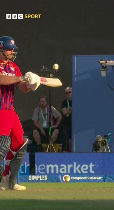 Paul Walter playing a shot