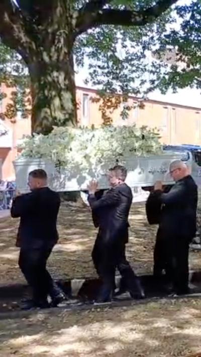 Fans paid tribute as Bonnie Tyler's coffin left the church after the funeral.