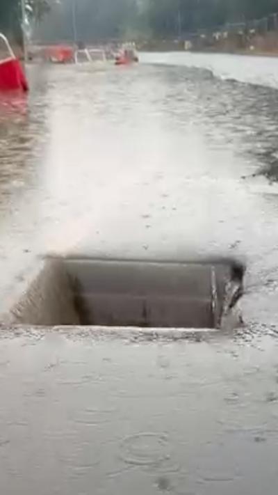 Flood water is draining into a hole on the motorway
