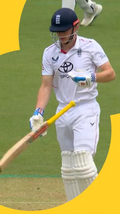 Harry Brook holds his bat as he walks off the crease