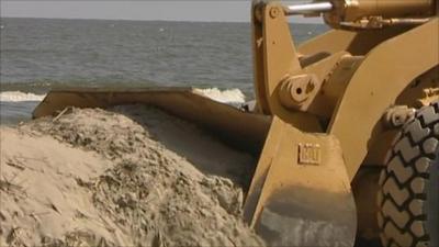 A digger moving sand