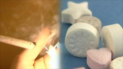 Joint being smoked and various drugs in pill form