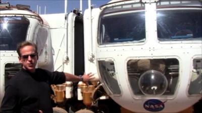 Nasa astronaut Mike Gernhardt with two rover prototypes
