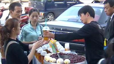 Street vendor and customers